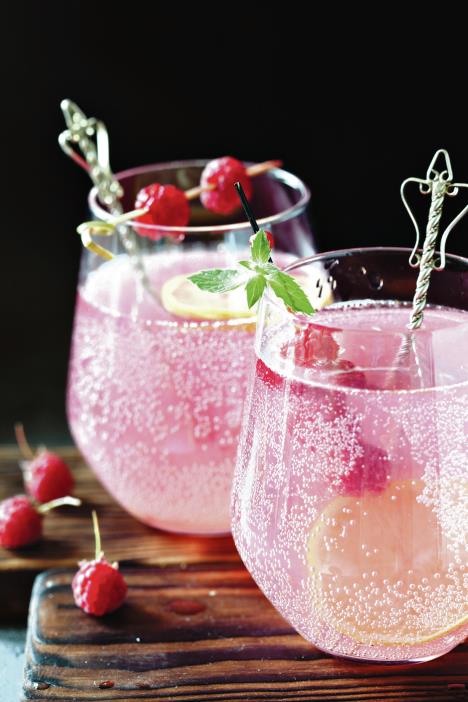 stockphotosparklingpinkraspberrylemonadeondarkbackground701695633.jpg