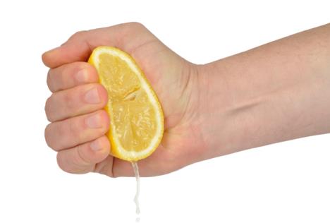 stockphotohandsqueezinglemonisolatedonwhite45982114.jpg