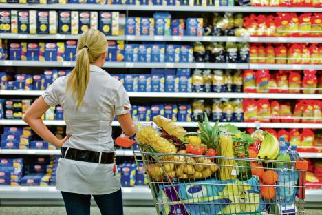 stockphotoawomanisoverwhelmedwiththewiderangeinthesupermarketwhenshopping133681769.jpg