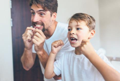 stockphotolittleboywithhisfatherinbathroomcleaningteethwithdentalflossbothlookinginmirrorand757784785.jpg