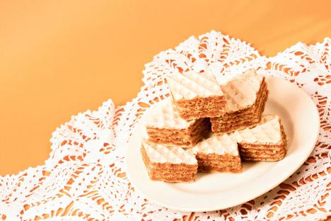 stockphotofilledwafercakesweetdessertisonplateonorangebackground1382406608.jpg