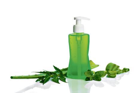 stockphotobottleofliquidsoaporcreamorfacewashdispenserswithaloeveraneemandbasilleafisolated1246449169.jpg