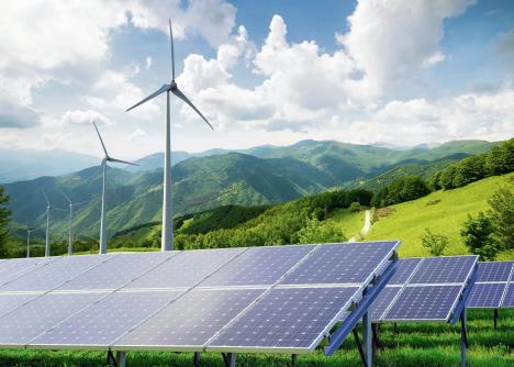 1203stockphotosolarpanelswithwindturbinesagainstmountanislandscapeagainstblueskywithclouds326698985.jpg