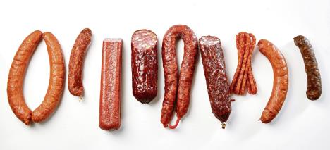 stockphotoflatlaystilllifeofaselectionofspicydriedorsmokedbeefandporksausagesisolatedon1091253158.jpg