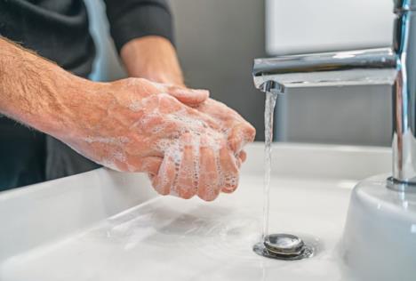 stockphotocoronavirustravelpreventionmanshowinghandhygienewashinghandswithsoapinhotwaterfor1666804420.jpg