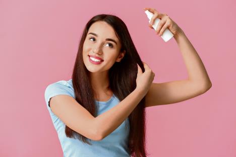 stockphotobeautifulyoungwomanwithhairsprayoncolorbackground1678540492.jpg