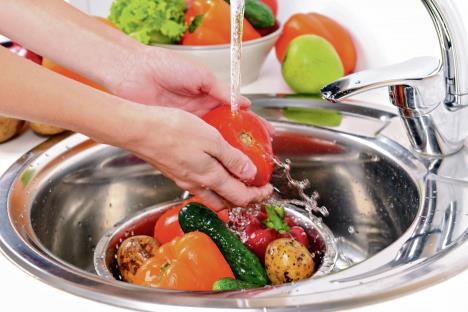 stockphotowashingfruitsandvegetablescloseup218649163.jpg