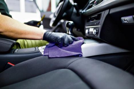 stockphotoamancleaningcarinteriorcardetailingorvaletingconceptselectivefocus1538741189.jpg