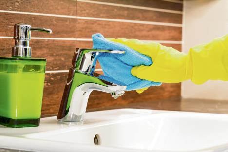 stockphotowomandoingchoresinbathroomcleaningmoderntap356285213.jpg