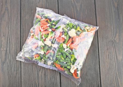 stockphotopacketoffrozenvegetablesonaoldwoodentabletopview479723227.jpg