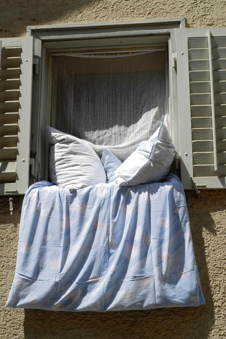 stockphotowindowwithbedclothes53730514.jpg