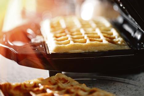 stockphotofreshlybakedtraditionalbelgianwafflesinironwafflemaker687552103-1500-1000.jpg