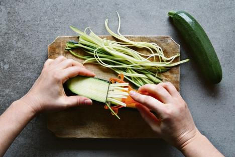 stockphotomakingjuliennezucchiniwithavegetablespeelertopview384847630-1500-1000.jpg