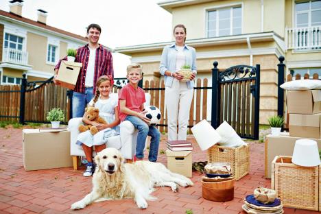 stockphotoportraitofhappyfamilywithtwochildrenandtheirgoldenretrieverdogstandingholding583816270.jpg