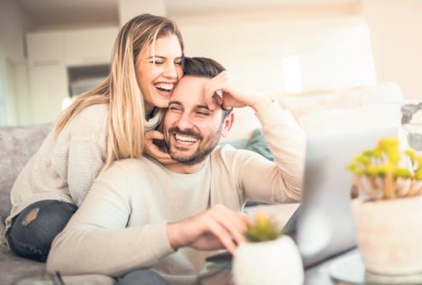 stockphotocloseupofyoungcoupleworkingonlaptopathome1024079236.jpg