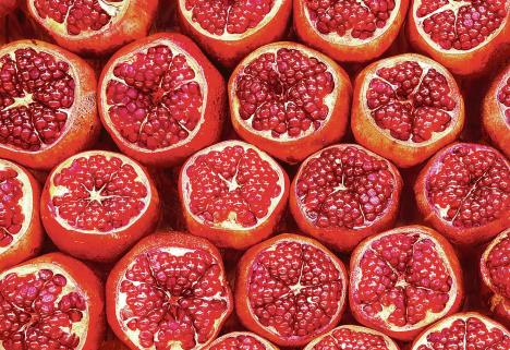 stockphotomanypomegranatecutinhalfpomegranatebackground1073338178.jpg