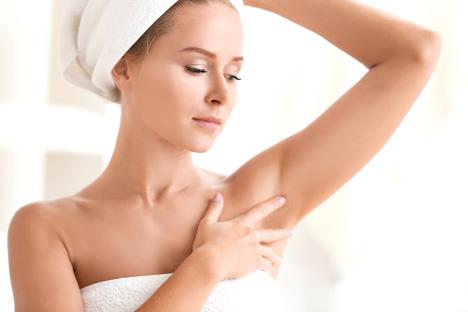 stockphotobeautifulyoungwomanaftershowerathomeconceptofusingdeodorant690752872.jpg