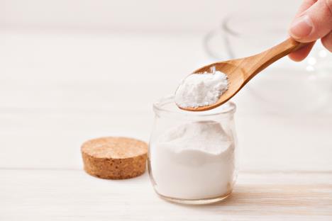 stockphotoseasaltstarchinthejarandwoodenspoonforrecipesofcosmeticsathomeonawhitewooden577880587.jpg