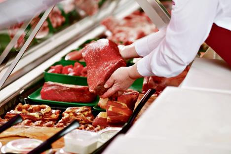 0802-stockphotosaleswomanofferingfreshmeatatdisplayinsupermarket143972128.jpg