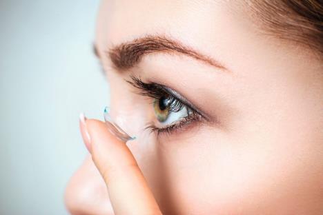 stockphotocloseupshotofyoungwomanwearingcontactlens1025167402.jpg