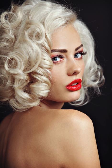 stockphotovintagestyleportraitofyoungbeautifulsexyblondepinupgirlwithcurlyhairandredlips493261885.jpg