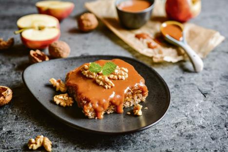 stockphotodeliciouswalnutcakewithgratedapplelayerandcarameltopping722617252.jpg