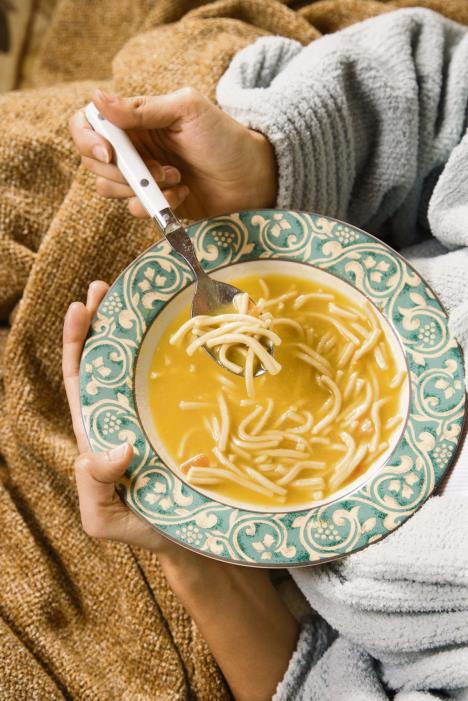 stockphotobowlofchickennoodlesoupheldincaucasianhispanichands3109540.jpg