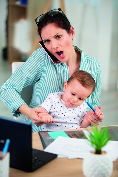 stockphototiredmotherworkingatofficewithherbaby1935733402-sm.jpg