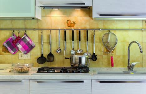 stockphotofrontviewofamodernwhitekitchenwithapotonthestove106277777-sm.jpg