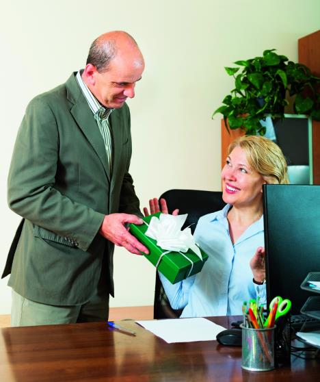 stockphotoaffairinofficebossgivingapresenttoassistant234912085-sm.jpg