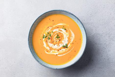 stockphotopumpkinandcarrotsoupwithcreamongreystonebackgroundcloseuptopview1157713954.jpg