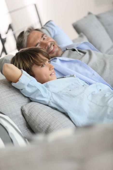 stockphotofatherandsonrelaxinginsofaathome267543950.jpg