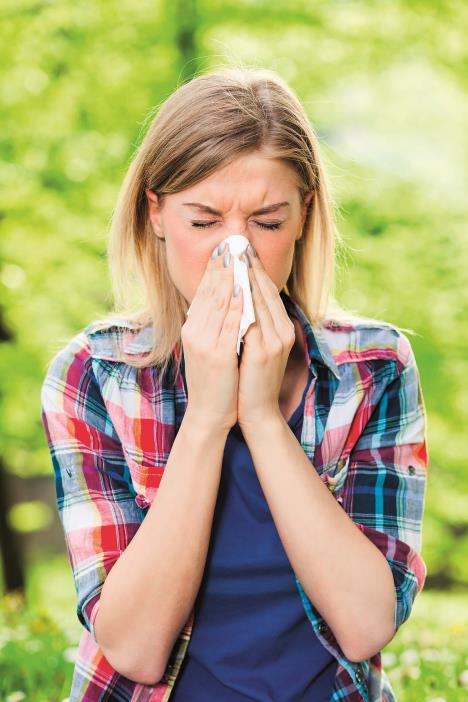 stockphotowomanwithwithallergysymptomblowingnose376912480.jpg