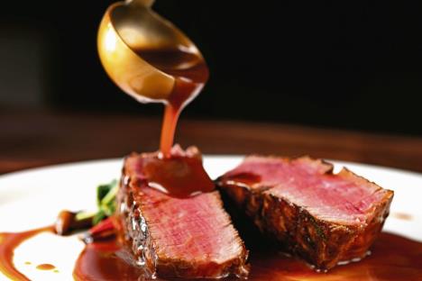 stockphotogrilledbeefsteakfiletmignonmediumrarepourdemiglacesauce1695736699.jpg