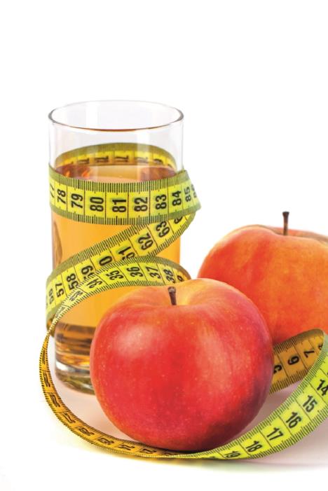 stockphotoapmrsavljenje-pleandapplejuicewithtapemeasureonwhitebackgroundhealtyfood1347312365.jpg