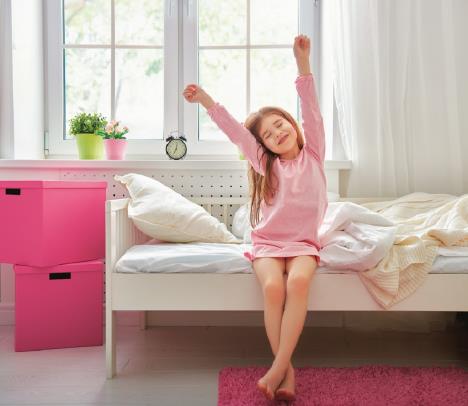 stockphotoanicechildgirlenjokrevet-yssunnymorninggoodmorningathomechildgirlwakesupfromsleep361236557.jpg