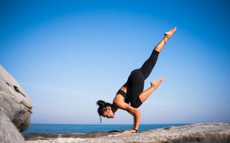 lowangleviewofwomanrelaxingonbeachagainstbluesky317157.jpg