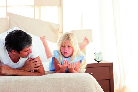 stockphotoadorablechildhavingdiscussionwithherfatherlyingonbed46375801.jpg