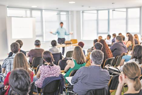 stock-photo-business-and-entrepreneurship-symposium-speaker-giving-a-talk-at-business-meeting-audience-in-2442851431.jpg