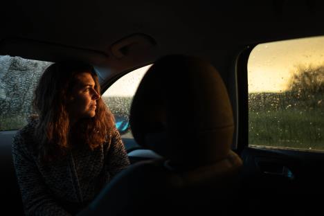 0604 stock-photo-portrait-of-young-woman-inside-car-while-raining-smile-face-looking-the-sunset-out-the-window-1960811698.jpg