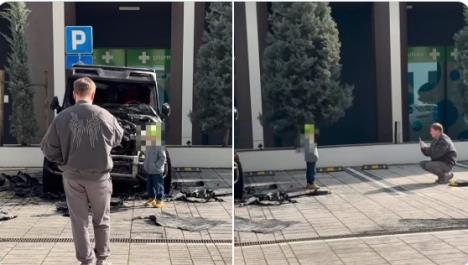 Otac slika dete pored spaljenog automobila Bake Praseta