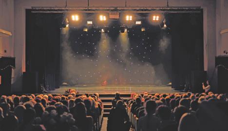 stock-photo-an-empty-stage-of-the-theater-lit-by-spotlights-and-smoke-before-the-performance-2397749061.jpg