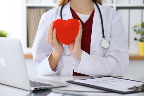 unknown-female-doctor-with-stethoscope-holding-heart-cardiology-medical-care-concept.jpg