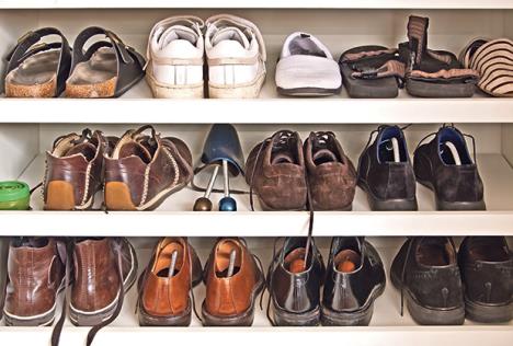 stockphotomenshoesonshelvesinacloset614570831.jpg