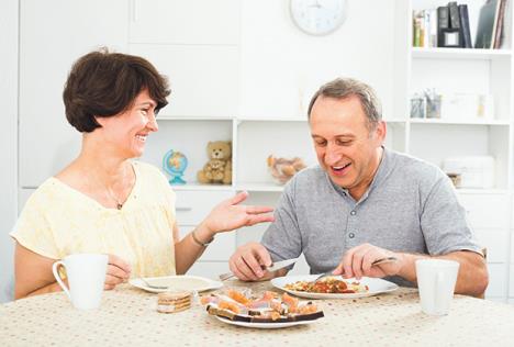 stockphotocheerfulsmilingmaturecoupleeatinglunchtogetherindoorsathome618391742.jpg