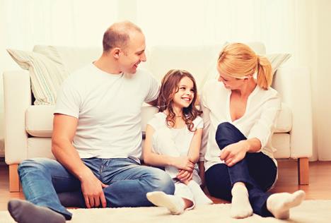 stockphotofamilychildandhomeconceptsmilingparentsandlittlegirlsittingonfloorathome316716914.jpg