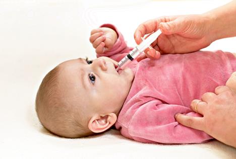 stockphotocutebabygetsmedicinewithasyringeinhismouth260735732.jpg