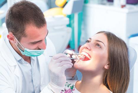 stockphotodoctortalkingwithherpatientdentistconcept685849348.jpg