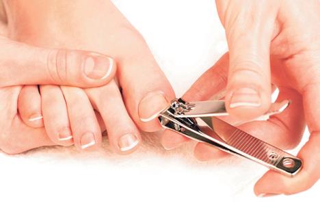 stockphotophotographycloseupofawomancuttingtoenails176393867.jpg