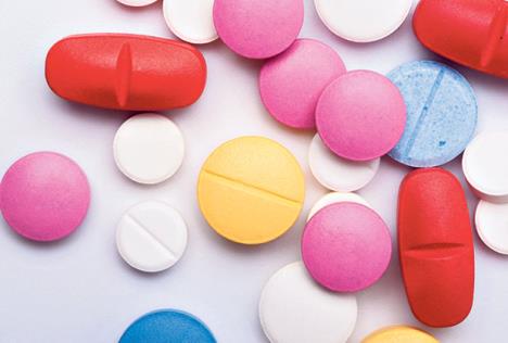 stockphotodifferentmulticoloredmedicamentsonwhitebackgroundantibioticpainkillermedicinepills695798818.jpg